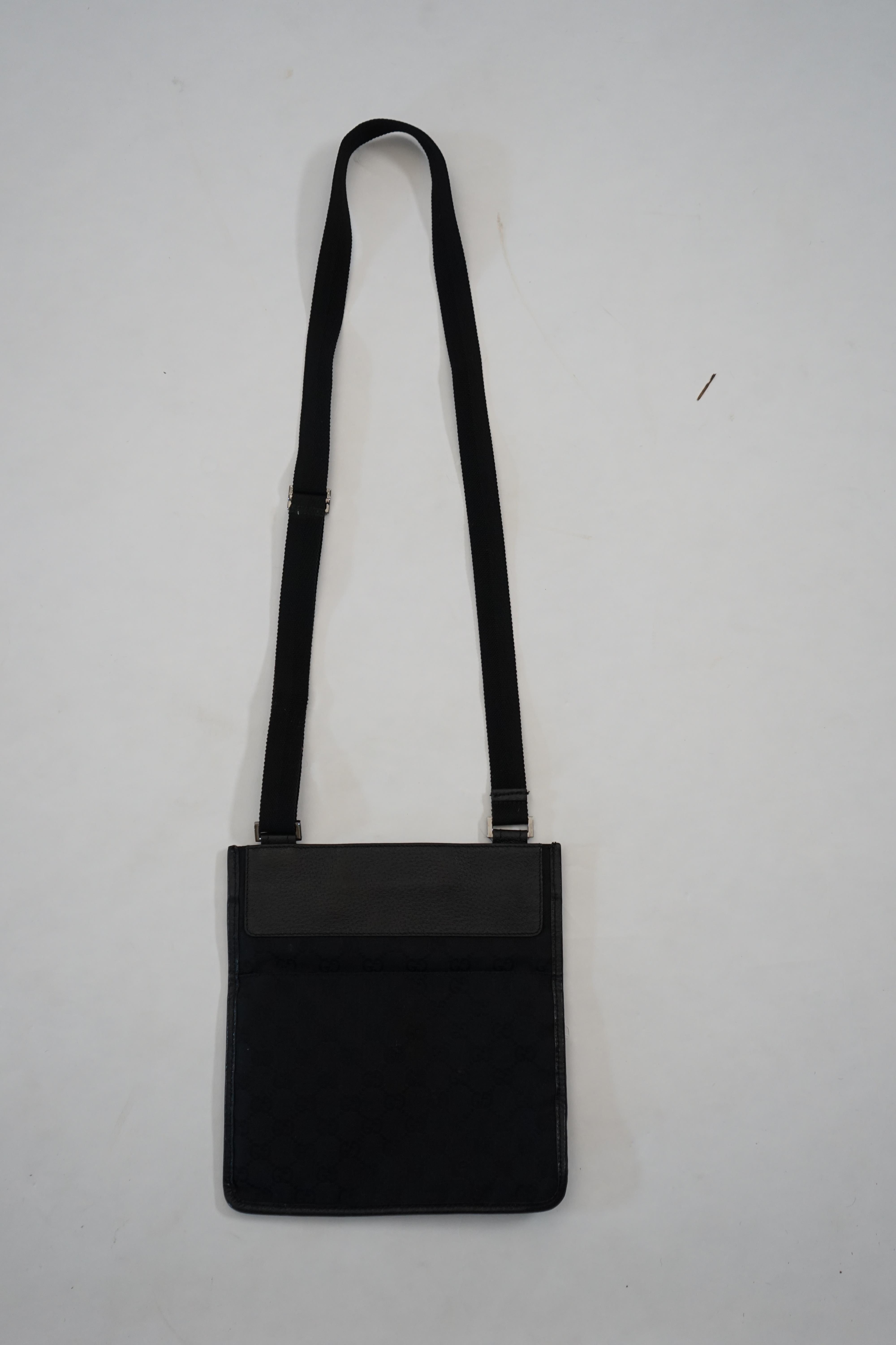 A Gucci black GG canvas crossbody bag Approx width 25cm, depth 1cm, length 24cm, shoulder drop 47cm
